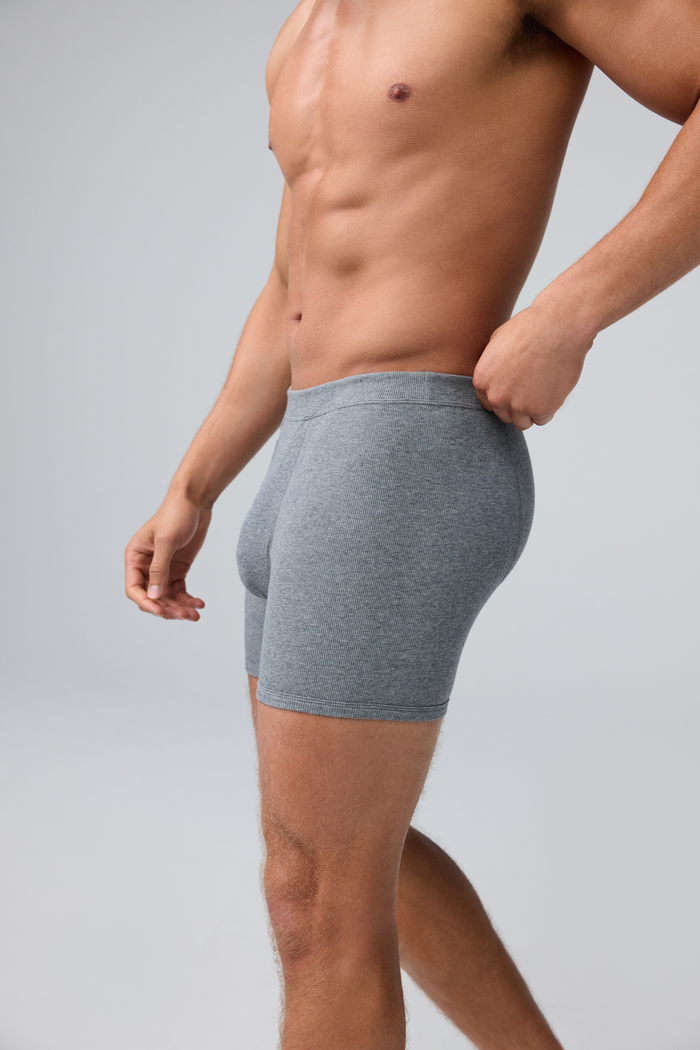 Side view of man wearing 18-Hour Jersey Rib Boxer Brief in Grey Heather
