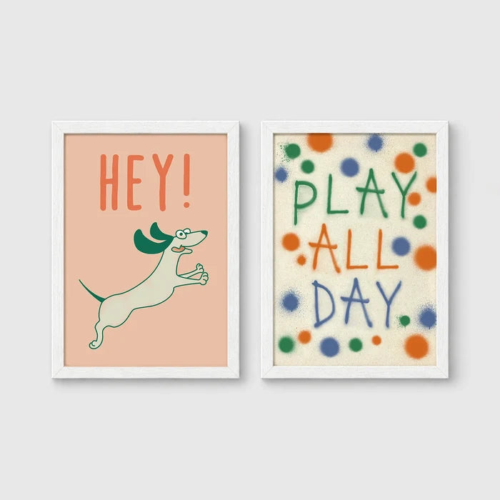 Set of 2 framed prints, playful kids' illustrations: a "Hey!" illustration of a leaping dachshund; and a "Play All Day" polka-dot typography print — unframed