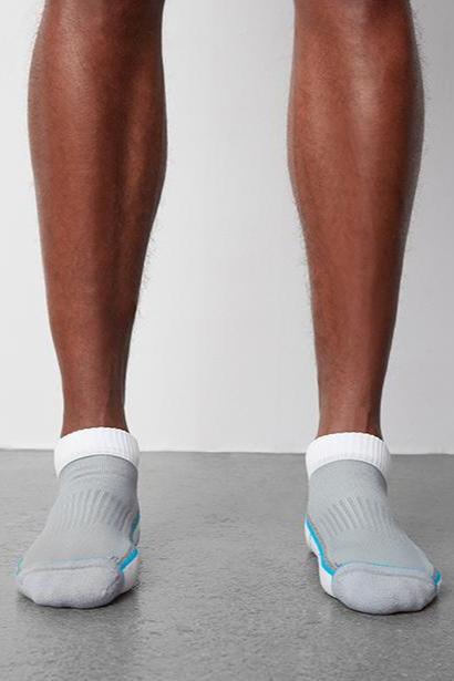 hover | Front view of a man wearing AIRKNITx Ankle Sock in Bright White / Weldon Blue