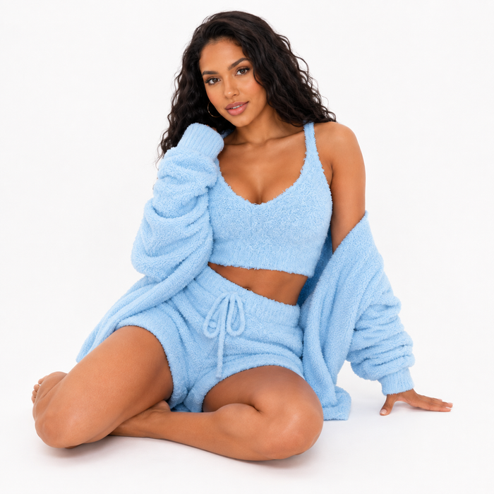 Women's three piece velvet lounge set with crop top, cardigan and drawstring shorts shown together on a clean white backdrop.