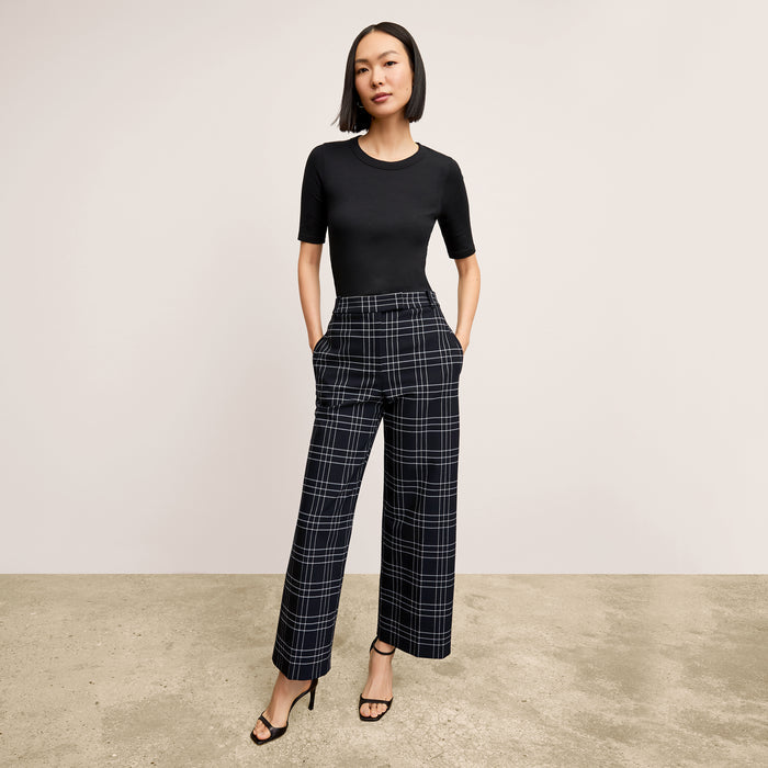 front image of a woman wearing the abby pant in plaid | Lead