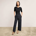 front image of a woman wearing the abby pant in plaid | Lead