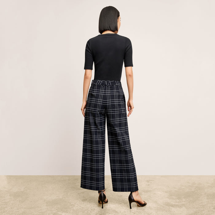 back image of a woman wearing the abby pant in plaid
