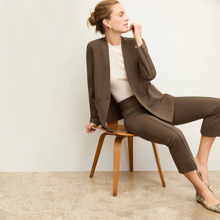 Front image of a woman wearing the allyn pants in ash