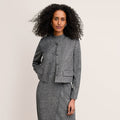 front image of a woman wearing the aniya jacket in black/white | Lead