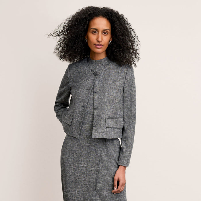 front image of a woman wearing the aniya jacket in black/white | Lead