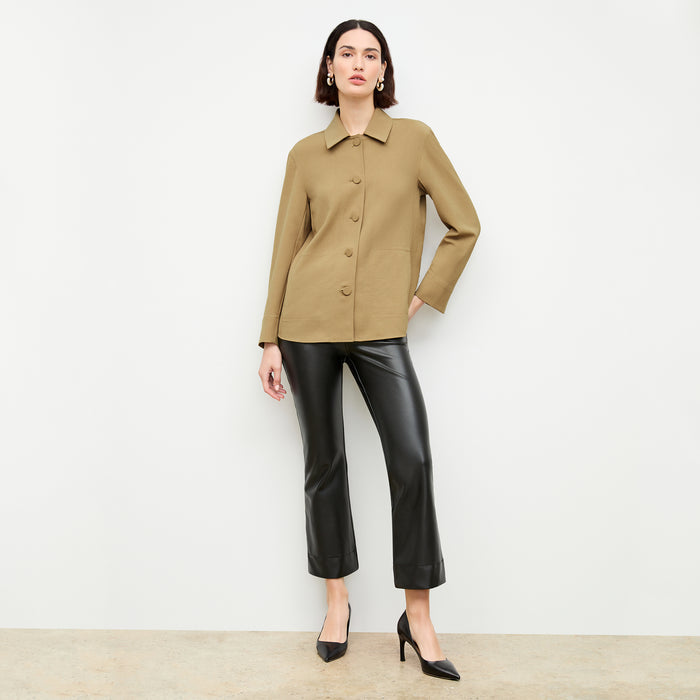 Front image of a woman wearing the archie pant in black