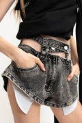 MANCANDY Ashes Chap Short in ash grey denim featuring a detached waistband, exposed pocket bags and chap-inspired curved side openings.