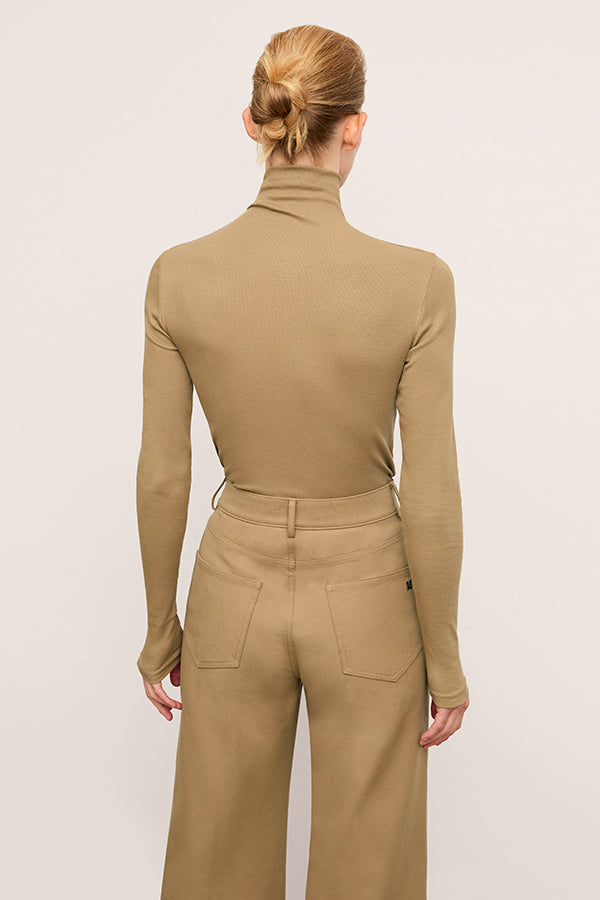 back image of a woman wearing the axam in saddle | Grid Hover | Exclude