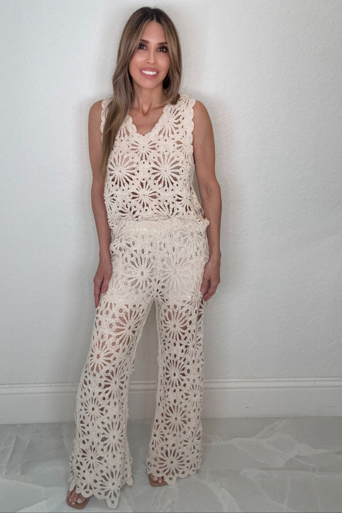 Beige boho crochet wide leg pants with a floral openwork pattern and flowing wide-leg silhouette.
