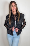 Black sleeveless denim vest with lace panel detailing, button front, and raw edge finish.