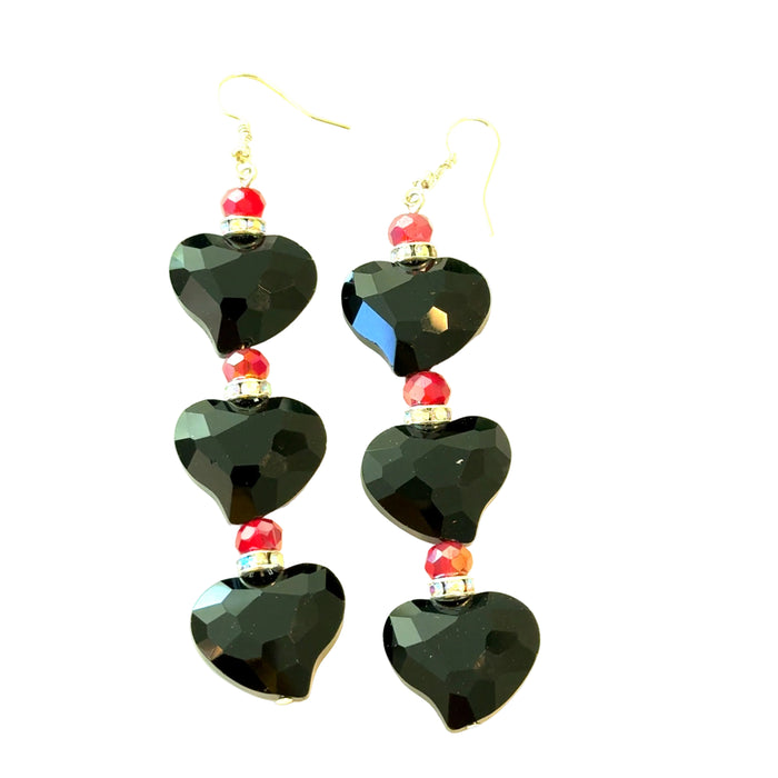 Black and red heart drop earrings with black faceted heart charms, red bead accents, and sterling silver hook posts.