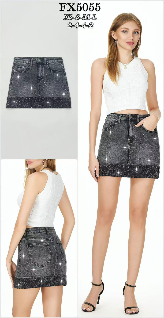 Black denim mini skirt with allover rhinestone embellishment and classic five-pocket styling.