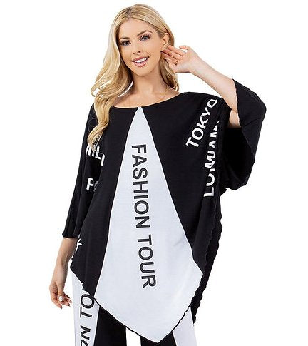 Black and white graphic tunic top with fashion letter print, three-quarter sleeves, and a distinctive V-point hemline.