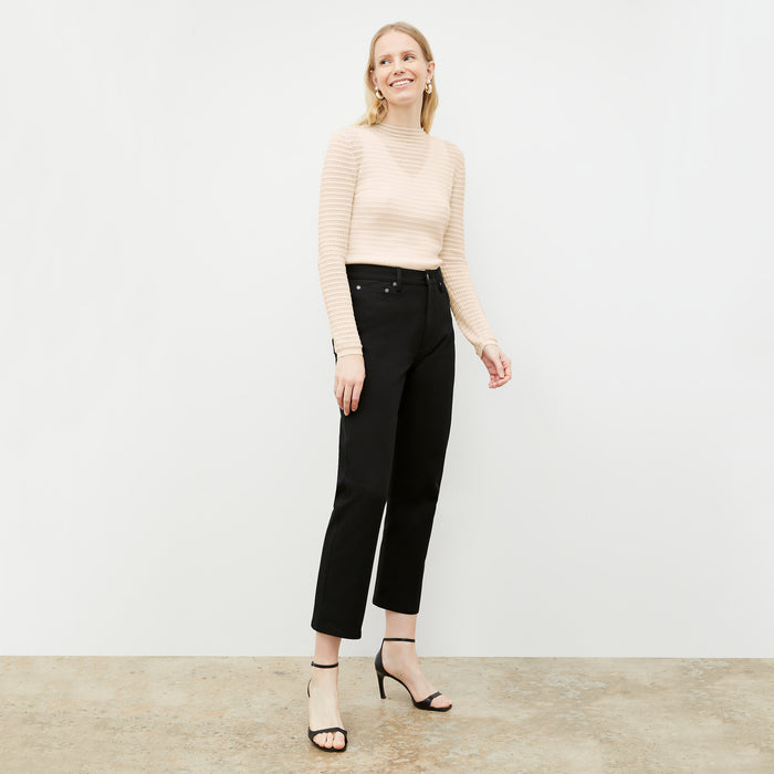 Front image of a woman wearing the Brodie Top in Meringue