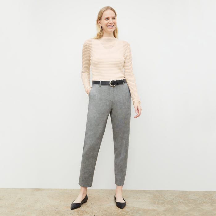Front image of a woman wearing the Brodie Top in Meringue