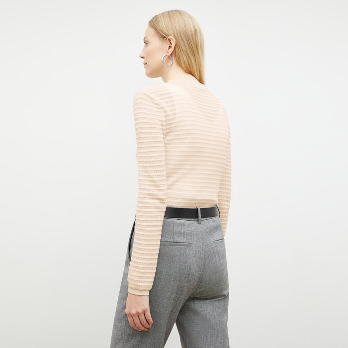 Front image of a woman wearing the Brodie Top in Meringue