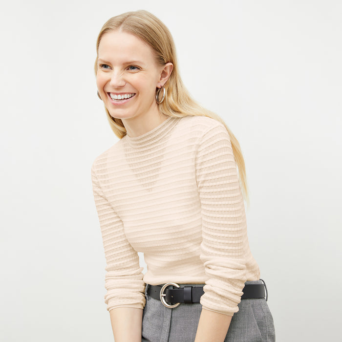 Front image of a woman wearing the Brodie Top in Meringue