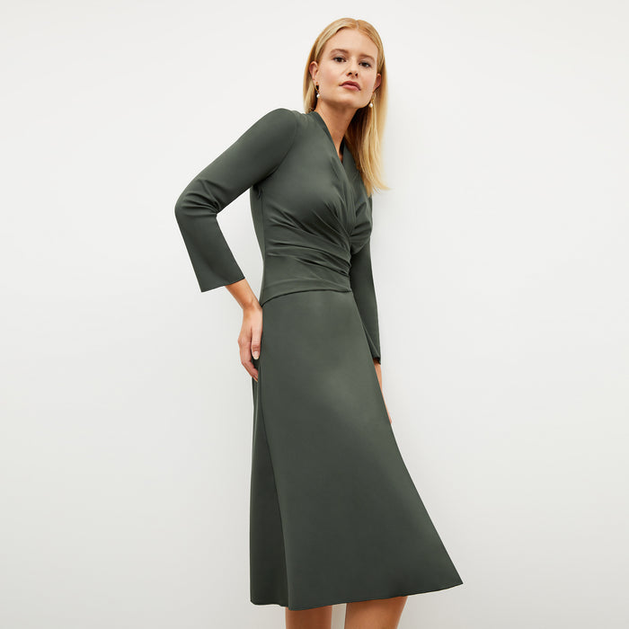 Image of a woman wearing the Carly Dress in Dark Aloe