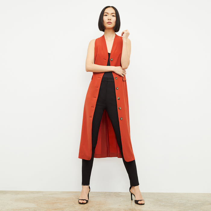 Front image of a woman wearing the Cassandra Dress in Blood Orange