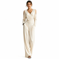 Apricot Milk Silk jumpsuit on a woman with visible face, V-neck wrap bodice, cold-shoulder sleeves, ruched waist and wide-leg pants.