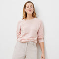 Front image of a woman standing wearing the chadwick top in peony | Lead