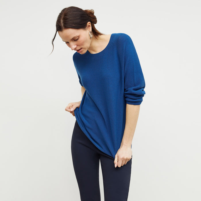 Front image of a woman standing wearing the chadwick top in shoreline | Lead