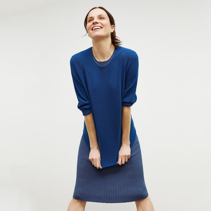 Front image of a woman standing wearing the chadwick top in shoreline