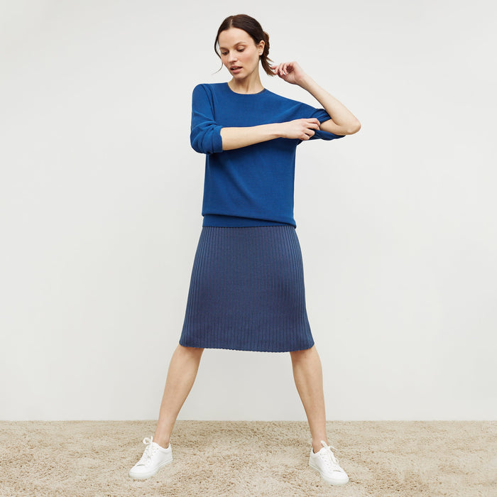 Front image of a woman standing wearing the chadwick top in shoreline