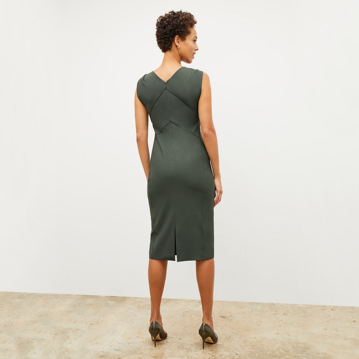 Image of a woman wearing the Charlene Dress in Dark Aloe
