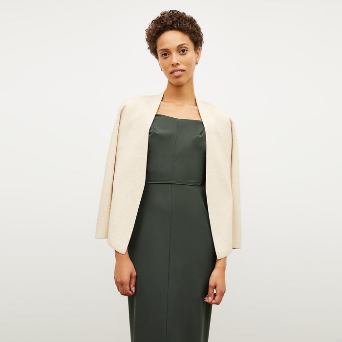 Image of a woman wearing the Charlene Dress in Dark Aloe