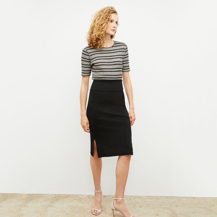 Front image of a woman wearing the charli in black and white