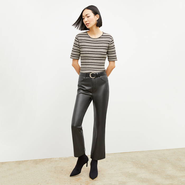 Front image of a woman wearing the charli in black and white