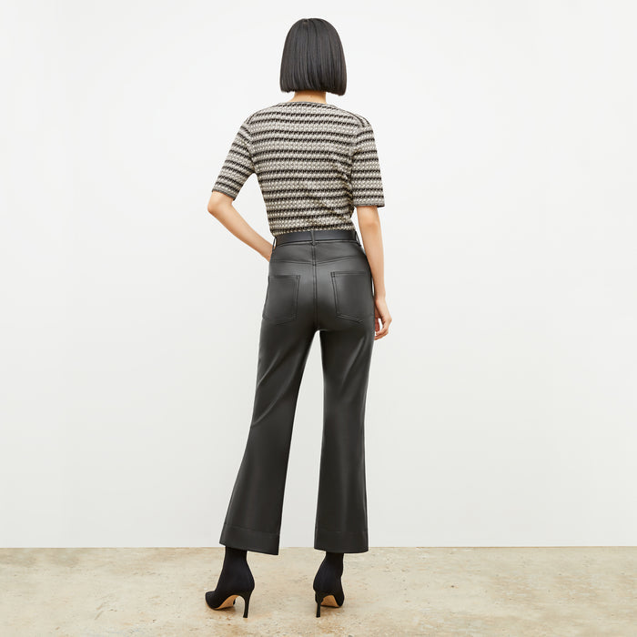 Back image of a woman wearing the charli in black and white