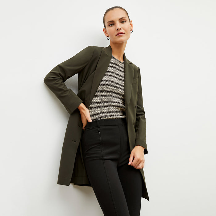 Front image of a woman wearing the charli in black and white