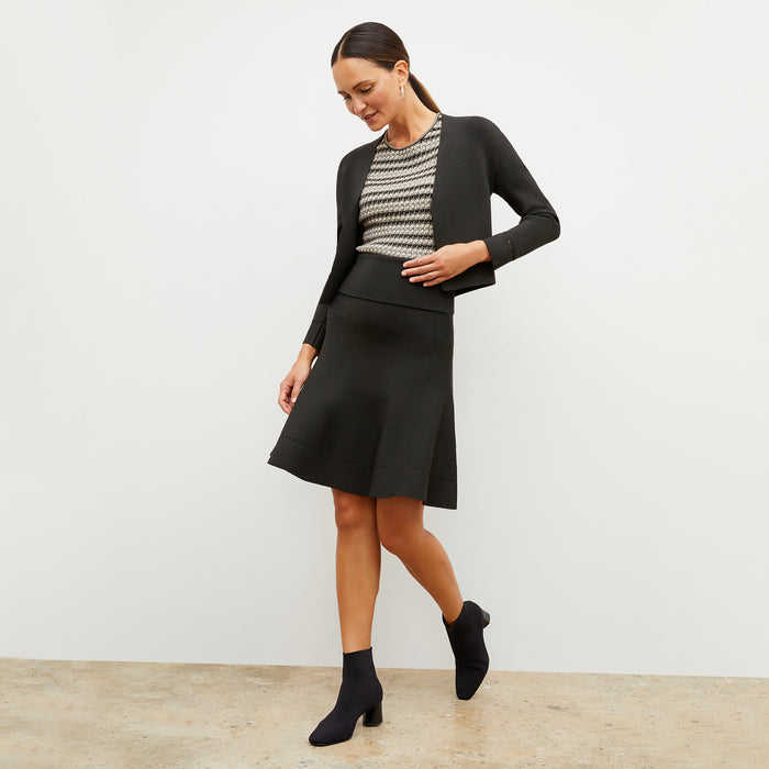 Front image of a woman wearing the charli in black and white