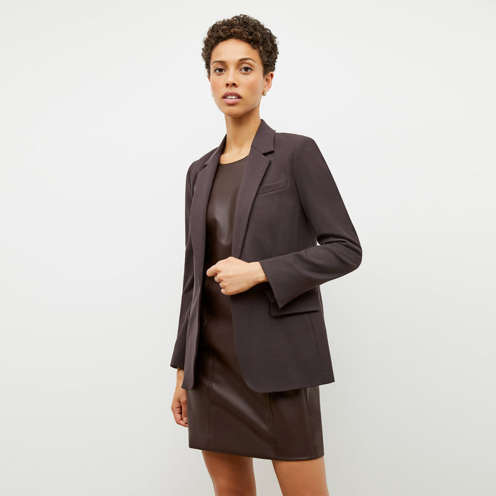 Front image of a woman wearing the Chloe Dress in Brown