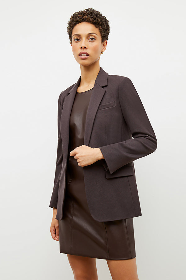 Front image of a woman wearing the Chloe Dress in Brown | Exclude