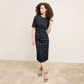 front image of a woman wearing the ciela dress in black/white | Lead