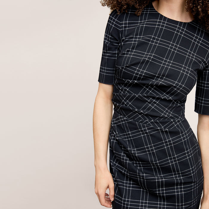 front image of a woman wearing the ciela dress in black/white