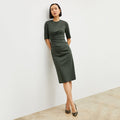 Image of a woman wearing the Ciela Dress in Dark Aloe | Lead