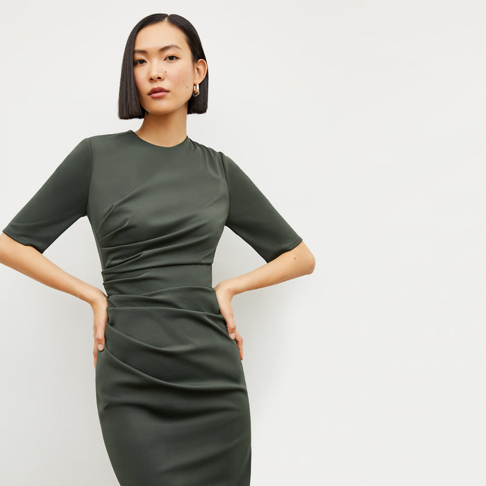 Image of a woman wearing the Ciela Dress in Dark Aloe