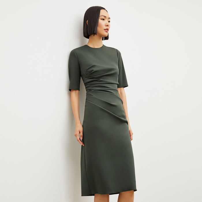 Image of a woman wearing the Ciela Dress in Dark Aloe