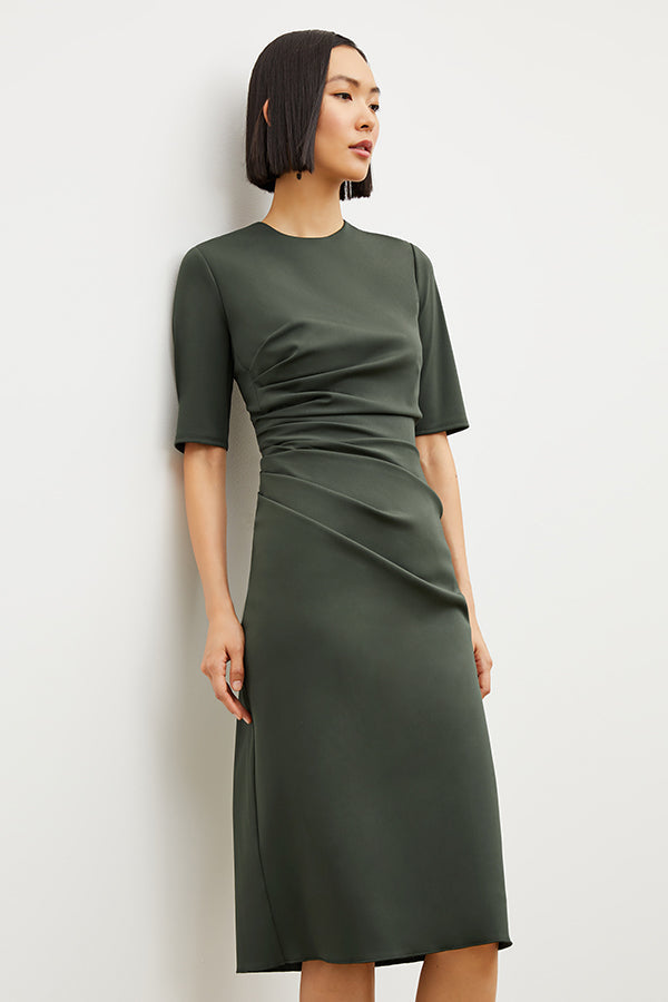 Image of a woman wearing the Ciela Dress in Dark Aloe | Exclude
