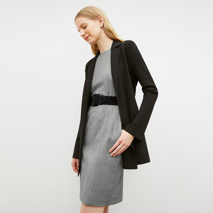 Front image of a woman wearing the constance dress in black and white