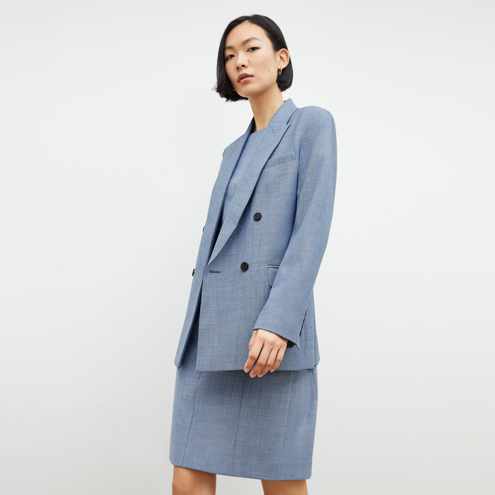 Front image of a woman wearing the constance dress in indigo and white