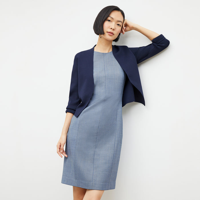 Front image of a woman wearing the constance dress in indigo and white