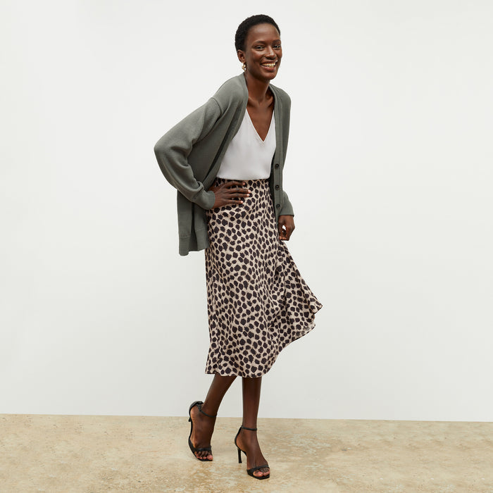front image of a woman wearing the cookie cardigan in fossil