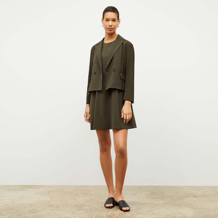 Front image of a woman wearing the Corrie Dress in Olive