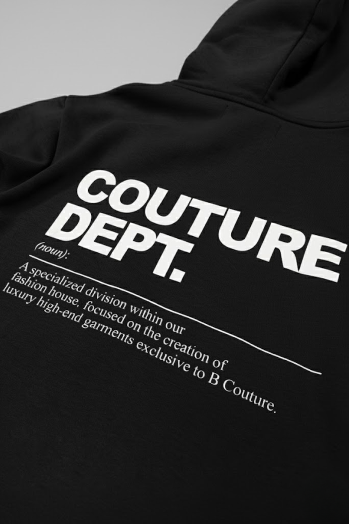 The Couture Dept Fleece Tracksuit - Black features bold white “COUTURE DEPT.” text and a definition below, blending streetwear flair with luxury—an exclusive B Couture piece ideal for men’s loungewear.